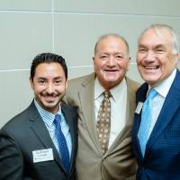 Three guests posing at the Foundation Annual Meeting